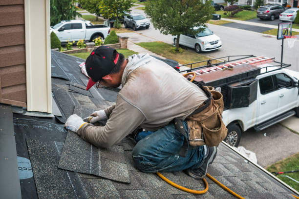 Professional Roofing technician working in East Boston, MA